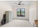 Bright bedroom with ample light, a large window, and a vintage cabinet at 9449 Freewoods Rd., Myrtle Beach, SC 29588