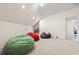 Large bonus room featuring a pitched ceiling, neutral walls, and colorful beanbag chairs at 9449 Freewoods Rd., Myrtle Beach, SC 29588