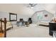 Spacious bonus room featuring a vaulted ceiling, neutral walls, and comfortable seating at 9449 Freewoods Rd., Myrtle Beach, SC 29588