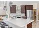 Open kitchen design featuring stainless steel appliances, marble countertops and an island with seating at 9449 Freewoods Rd., Myrtle Beach, SC 29588