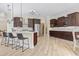 Modern kitchen featuring an island with bar stools, stainless steel appliances, and ample cabinet space at 9449 Freewoods Rd., Myrtle Beach, SC 29588