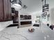 Spacious kitchen features a large island with granite countertops and pendant lighting at 9449 Freewoods Rd., Myrtle Beach, SC 29588