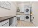 Bright laundry room features stacked washer and dryer, workstation and ample storage at 9449 Freewoods Rd., Myrtle Beach, SC 29588