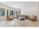 Bright and spacious living room with large windows and comfortable seating at 9449 Freewoods Rd., Myrtle Beach, SC 29588