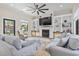 Spacious living room with a fireplace, built-in bookshelves, and plush seating at 9449 Freewoods Rd., Myrtle Beach, SC 29588