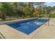 Inviting pool features a built-in jacuzzi, offering a relaxing backyard oasis at 9449 Freewoods Rd., Myrtle Beach, SC 29588