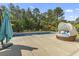 Refreshing pool with a jacuzzi, lounge seating, and colorful umbrellas, perfect for relaxation at 9449 Freewoods Rd., Myrtle Beach, SC 29588