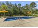 Swimming pool with a built-in spa with surrounding concrete patio area, perfect for relaxation at 9449 Freewoods Rd., Myrtle Beach, SC 29588
