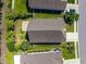 Aerial view of a home with a well-manicured yard and a brick patio at 962 Witherbee Way, Little River, SC 29566