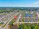 Community aerial view showcasing houses, ponds, and the location pin at 962 Witherbee Way, Little River, SC 29566