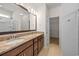 Bathroom featuring a double vanity with granite countertops and a large framed mirror at 962 Witherbee Way, Little River, SC 29566