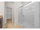 Bright bathroom featuring a glass-enclosed shower and a walk-in closet at 962 Witherbee Way, Little River, SC 29566
