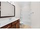 Bathroom featuring a single sink vanity and a bathtub with a shower at 962 Witherbee Way, Little River, SC 29566