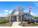 A welcoming clubhouse with stone columns and landscaped gardens provides a great community gathering spot at 962 Witherbee Way, Little River, SC 29566