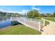 Community dock with a wooden deck and white railings at 962 Witherbee Way, Little River, SC 29566