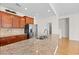Spacious kitchen with granite countertops, stainless steel appliances, and dark wood cabinets offering ample storage at 962 Witherbee Way, Little River, SC 29566