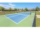 Community pickleball courts with a green and blue surface and black net at 962 Witherbee Way, Little River, SC 29566