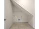 Small storage room with tile floor and some shelving at 962 Witherbee Way, Little River, SC 29566