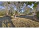 Spacious backyard with mature trees, offering a serene and private outdoor space at 9628 Indigo Creek Blvd., Murrells Inlet, SC 29576