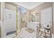 Bright bathroom featuring a glass shower, white cabinets, and a large mirror at 9628 Indigo Creek Blvd., Murrells Inlet, SC 29576