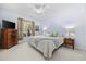 Comfortable bedroom with a ceiling fan, and a dresser near a sunlit window at 9628 Indigo Creek Blvd., Murrells Inlet, SC 29576