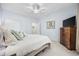 Bedroom with a large bed, dresser, and direct access to an en-suite bathroom at 9628 Indigo Creek Blvd., Murrells Inlet, SC 29576