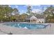 Inviting community pool with ample seating, surrounded by lush landscaping, perfect for relaxation at 9628 Indigo Creek Blvd., Murrells Inlet, SC 29576