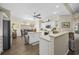 Bright kitchen featuring white cabinets, an island, and an adjacent dining area, perfect for cooking and entertaining at 9628 Indigo Creek Blvd., Murrells Inlet, SC 29576