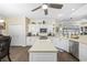 Bright kitchen with a center island, stainless steel appliances, and white cabinetry at 9628 Indigo Creek Blvd., Murrells Inlet, SC 29576