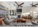 Spacious living room featuring a stone fireplace, built-in shelving, and a comfortable sectional sofa at 9628 Indigo Creek Blvd., Murrells Inlet, SC 29576
