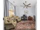 Home office featuring a ceiling fan, two armchairs, and a large window at 9628 Indigo Creek Blvd., Murrells Inlet, SC 29576