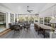 Relaxing sunroom with wicker furniture, a ceiling fan, and lots of natural light at 9628 Indigo Creek Blvd., Murrells Inlet, SC 29576