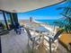 Relaxing balcony featuring a table set, chairs and views of the beach and ocean at 9650 Shore Dr. # 2007, Myrtle Beach, SC 29572