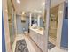 Well-appointed bathroom with a glass-enclosed shower, white vanity, and blue accents for a clean and serene atmosphere at 9650 Shore Dr. # 2007, Myrtle Beach, SC 29572