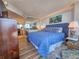 Well-lit bedroom features a queen-sized bed, mirrored wall, and a cozy rug, creating a comfortable and inviting space at 9650 Shore Dr. # 2007, Myrtle Beach, SC 29572