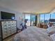 Bright bedroom with a large window overlooking the ocean and a balcony at 9650 Shore Dr. # 2007, Myrtle Beach, SC 29572