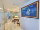 Inviting hallway with marble floors and a framed painting that leads into other beautifully decorated rooms at 9650 Shore Dr. # 2007, Myrtle Beach, SC 29572