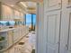 Spacious kitchen with sleek white cabinetry, countertops, tiled flooring and great views at 9650 Shore Dr. # 2007, Myrtle Beach, SC 29572