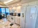 This kitchen features bright white appliances and ocean views at 9650 Shore Dr. # 2007, Myrtle Beach, SC 29572