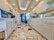 Spacious kitchen featuring white cabinets, marble floors, and an open layout with ocean views at 9650 Shore Dr. # 2007, Myrtle Beach, SC 29572