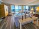 A light-filled living room boasts a view of the ocean and stylish furnishings at 9650 Shore Dr. # 2007, Myrtle Beach, SC 29572