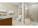 Functional bathroom featuring a granite countertop sink, toilet and glass shower stall at 9994 Beach Club Dr. # 2403, Myrtle Beach, SC 29572