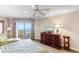 Bright bedroom with balcony access offering stunning ocean views and comfortable sitting area at 9994 Beach Club Dr. # 2403, Myrtle Beach, SC 29572