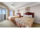 Inviting bedroom with two beds, balcony access and coastal view at 9994 Beach Club Dr. # 2403, Myrtle Beach, SC 29572