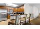 Modern kitchen featuring granite countertops, stainless steel appliances, and stylish breakfast bar seating at 9994 Beach Club Dr. # 2403, Myrtle Beach, SC 29572