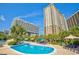 Outdoor pool with palm trees and lounge chairs at 9994 Beach Club Dr. # 2403, Myrtle Beach, SC 29572