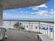 Balcony view showcasing the oceanfront with beach access, lounge chair and seating at 1012 N Waccamaw Dr. # 301, Garden City Beach, SC 29576