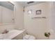 Bathroom features a toilet with paper safety band, seashell decor, and vanity at 1012 N Waccamaw Dr. # 301, Garden City Beach, SC 29576