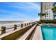 Breathtaking view of the beach from the pool area, complete with beach access and ocean vistas at 1012 N Waccamaw Dr. # 301, Garden City Beach, SC 29576