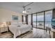 Bright bedroom with sliding glass doors to a balcony overlooking the ocean at 1012 N Waccamaw Dr. # 301, Garden City Beach, SC 29576